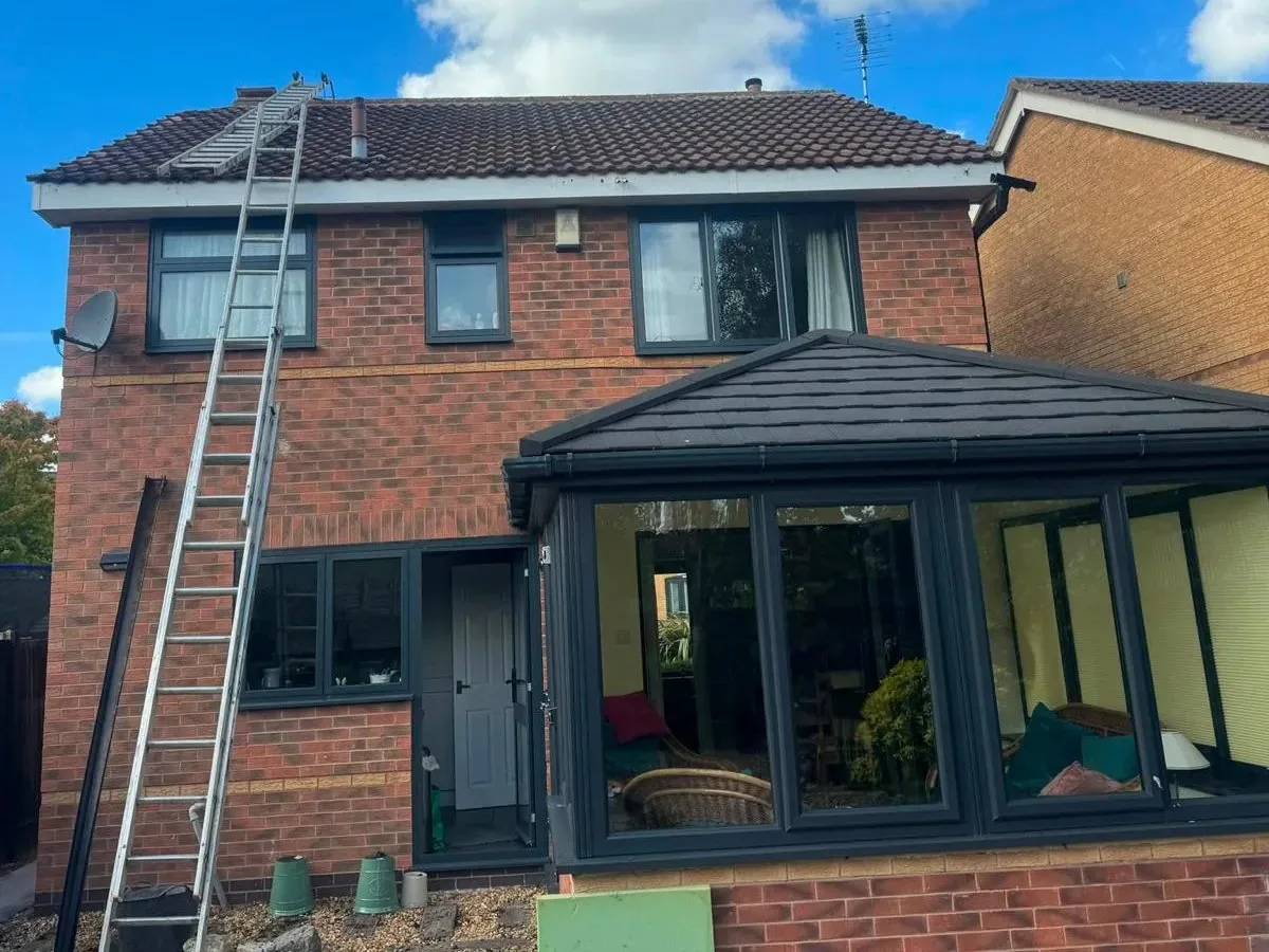 Tiled conservatory roof fitted to a detached house in Wilmslow