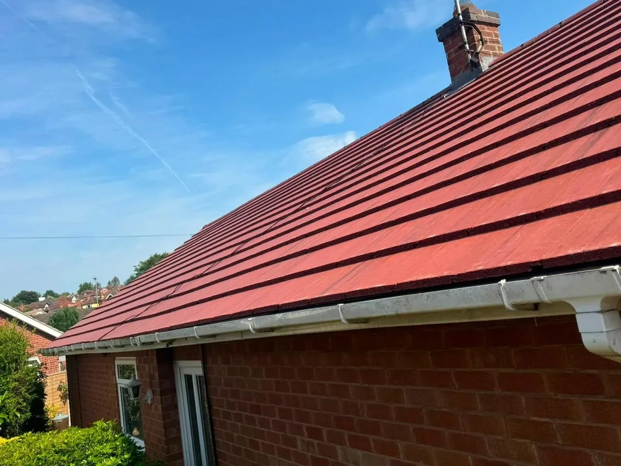 New red tile roof and white guttering on a bungalow overlooking the hills near Buxton