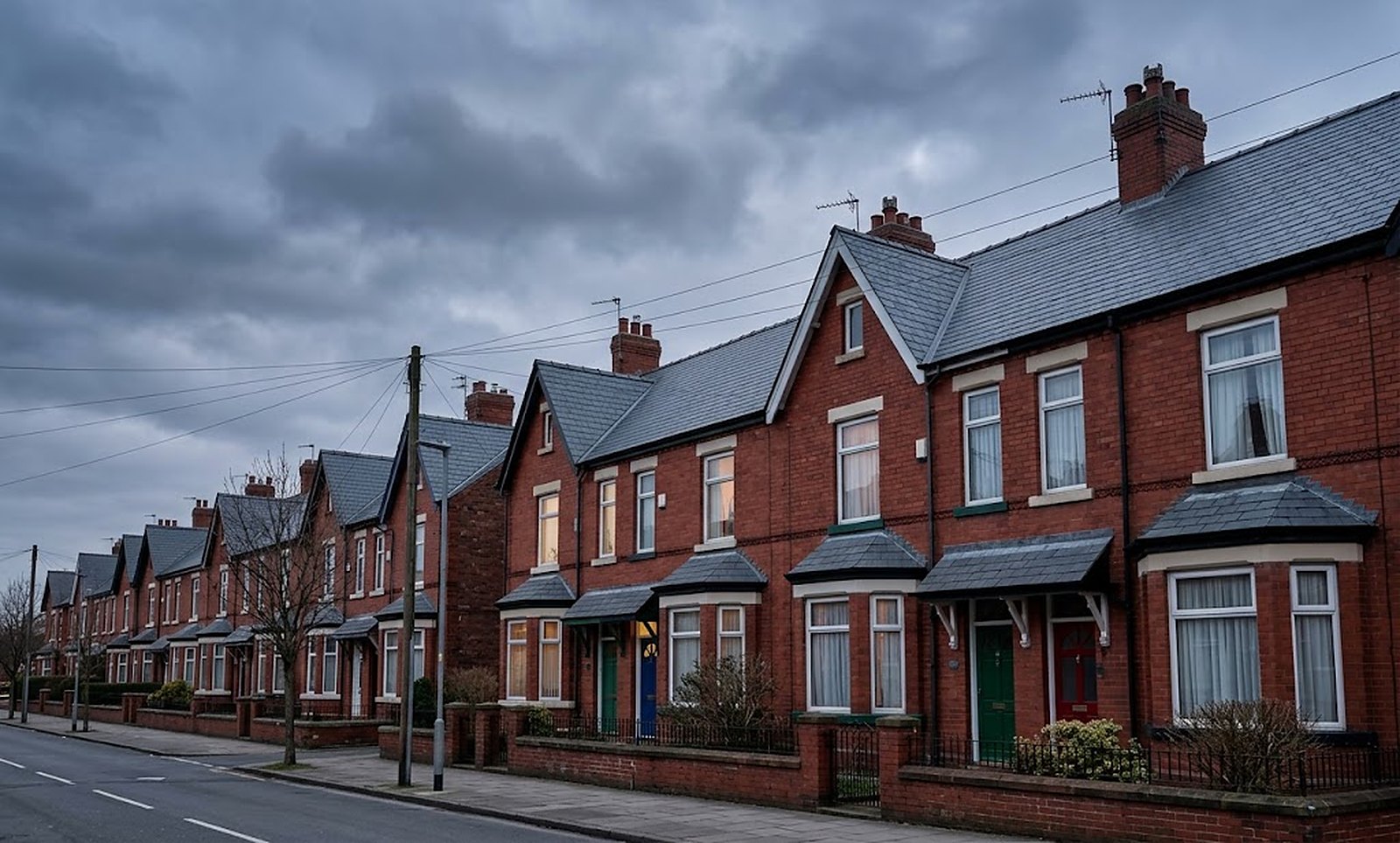 Photo of a terrace of slate-roofed houses in Denton at dusk